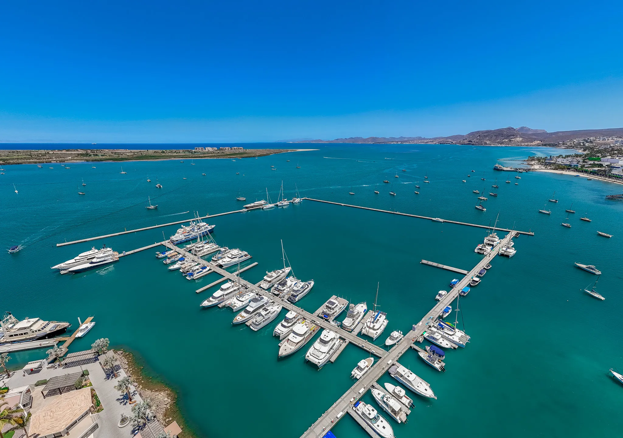 Luxury marina infrastructure in Sea of Cortez with stabilized floating docks and mooring systems